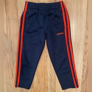 Adidas track pants.